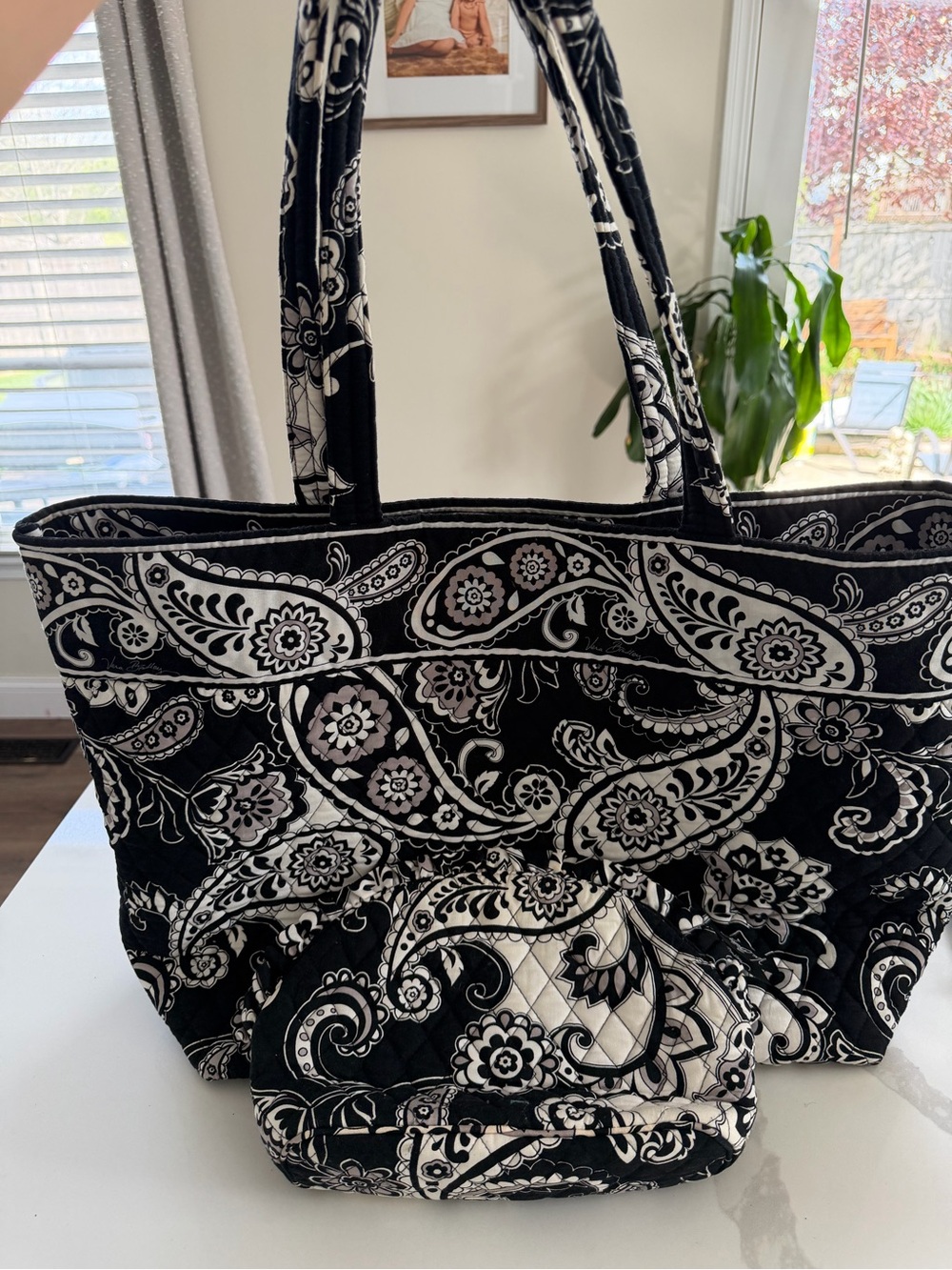 quilted Vera Bradley tote bag in a black and white paisley print